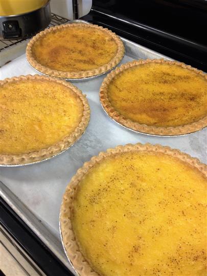 Baked pies fresh out the oven on baking sheet