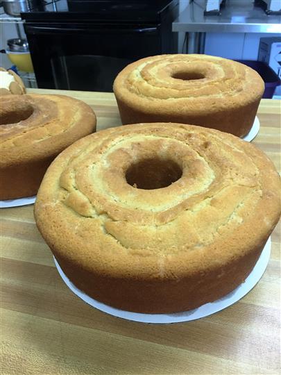 Doughnut hole cakes fresh out the oven on a wooden table