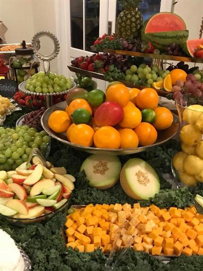 Assortment of a plethora of fruits on a table with a arranged display