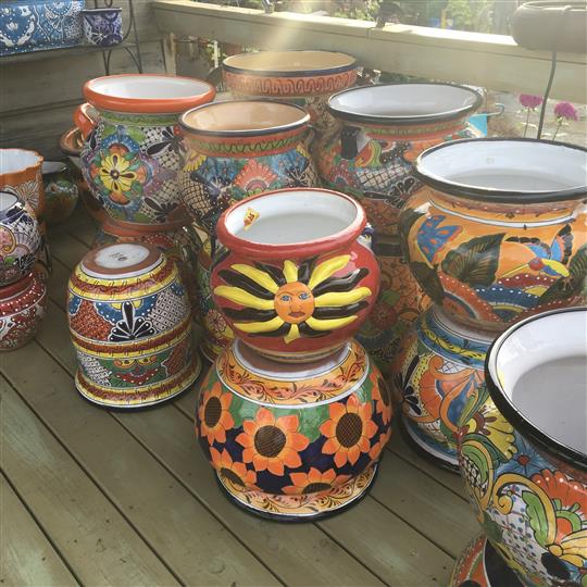 Flower pots with decorative paints on each one