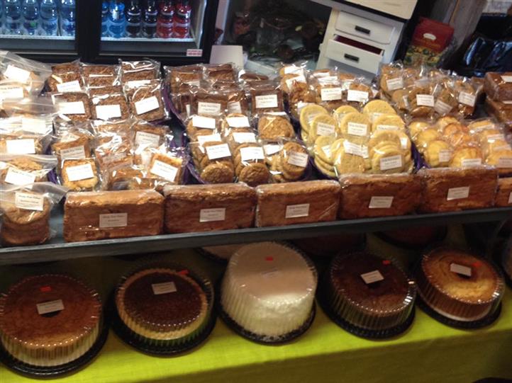 Baked assortment of cakes, pies, and cookies on a display