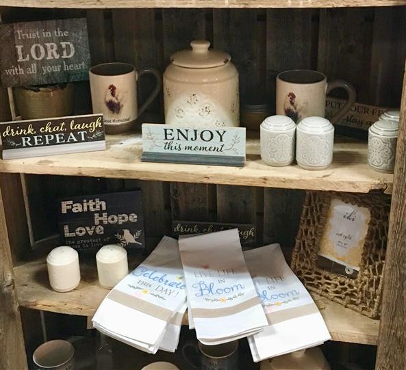 Gift shop display with towels and mugs
