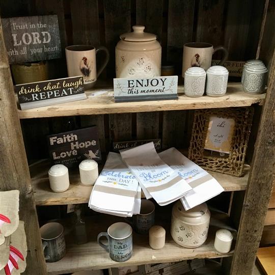 Gift shop display with towels and mugs