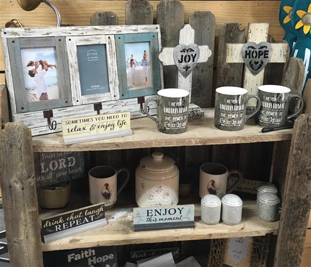 Gift shop with mugs, signs, and picture frames