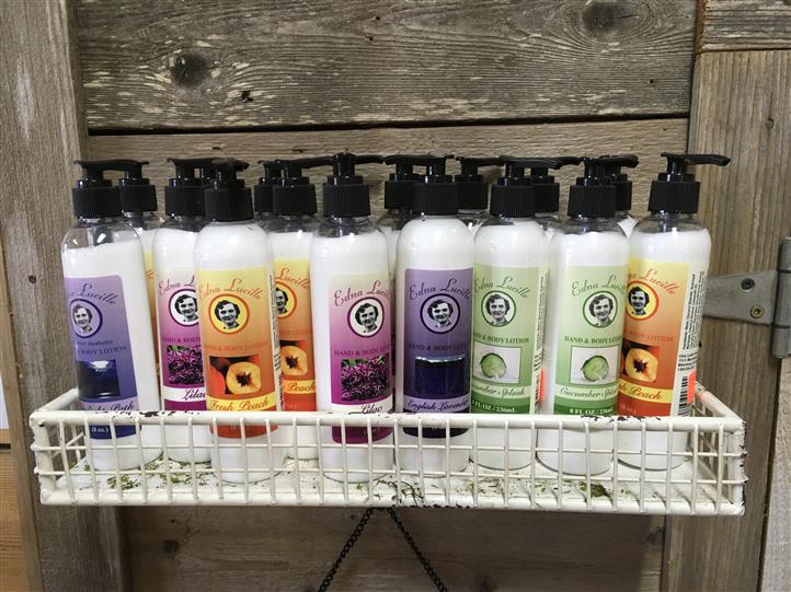 Fruit scented soaps on a rack on a display.