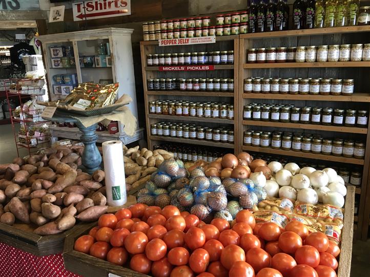 Vegetables in a wooden basket on sale on a table