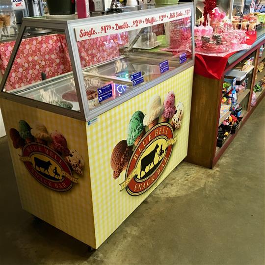 Blue Bell ice cream freezer with prices on the display