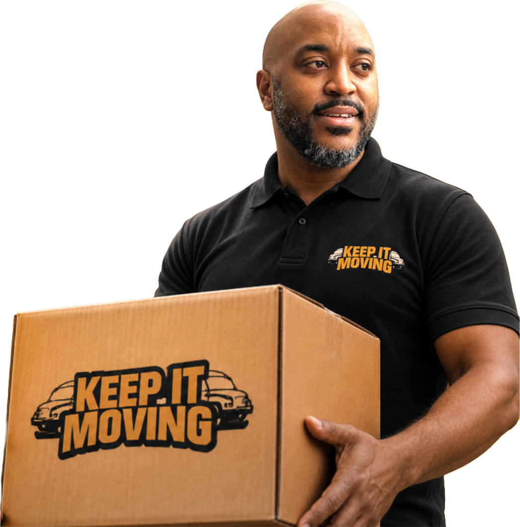 owner of keep it moving carrying a box