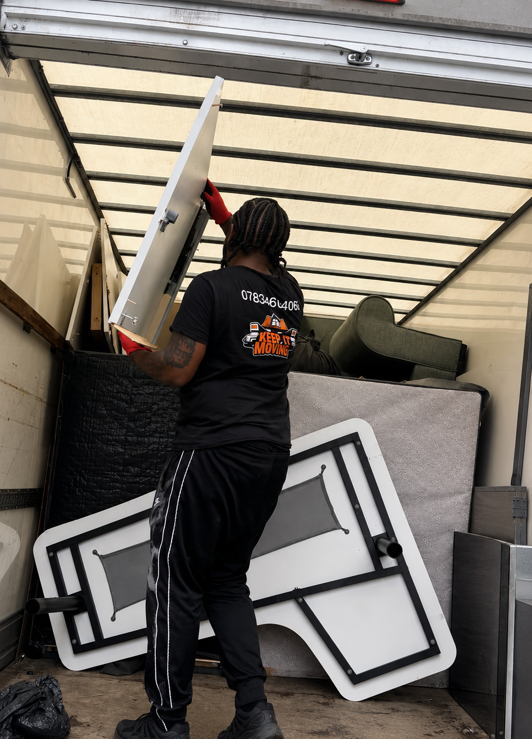 keep it moving team moving stuff in giant van