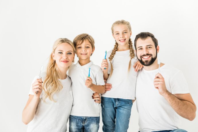 Happy Family With Toothbrushes — Clifton, NJ — Brian G. DePetris, DMD