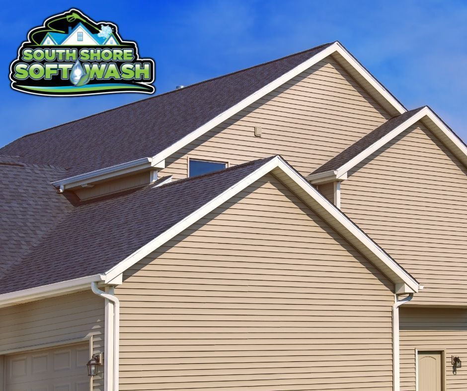 A house with a roof that is being cleaned by south shore soft wash