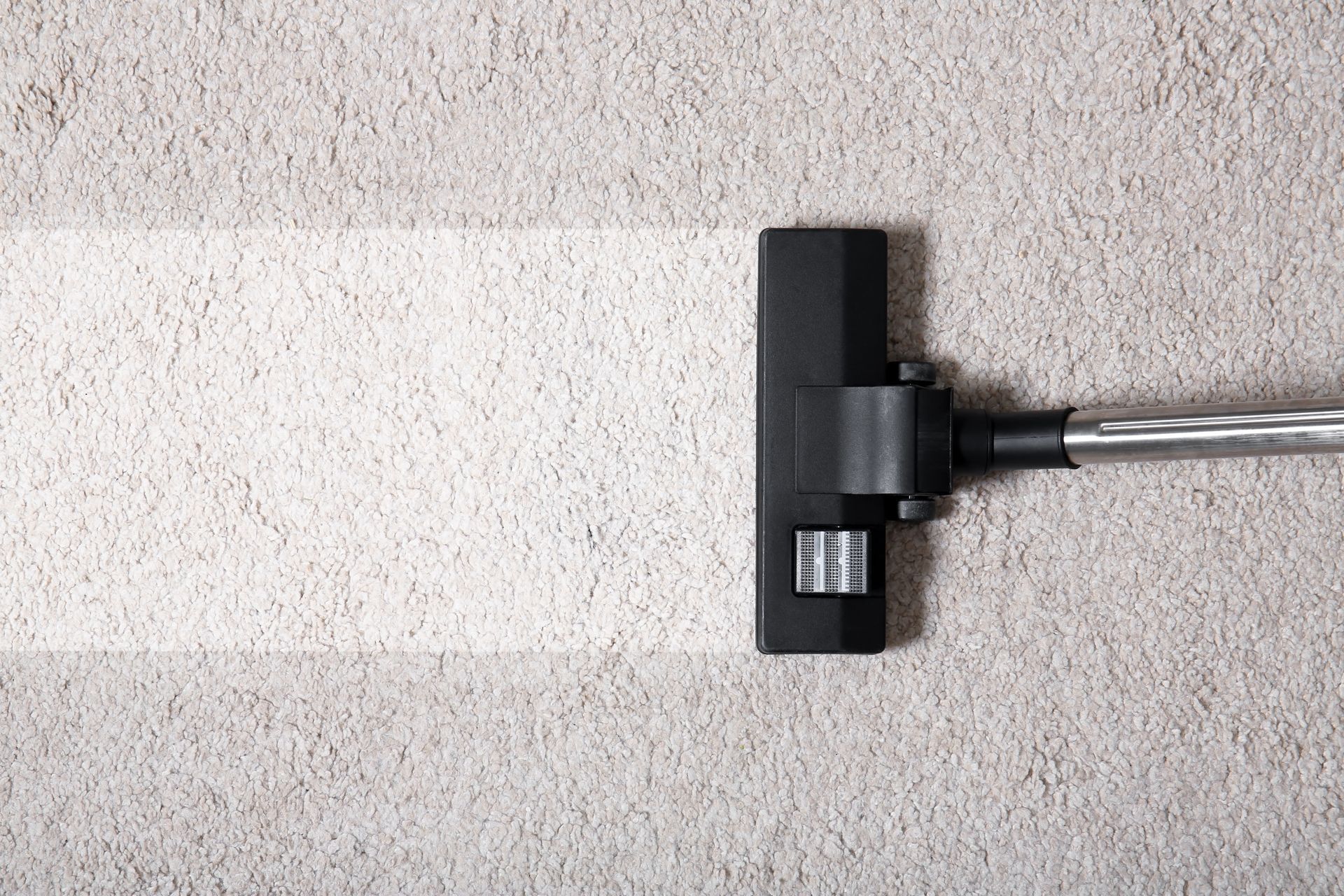 Vacuum cleaner on carpet indoors