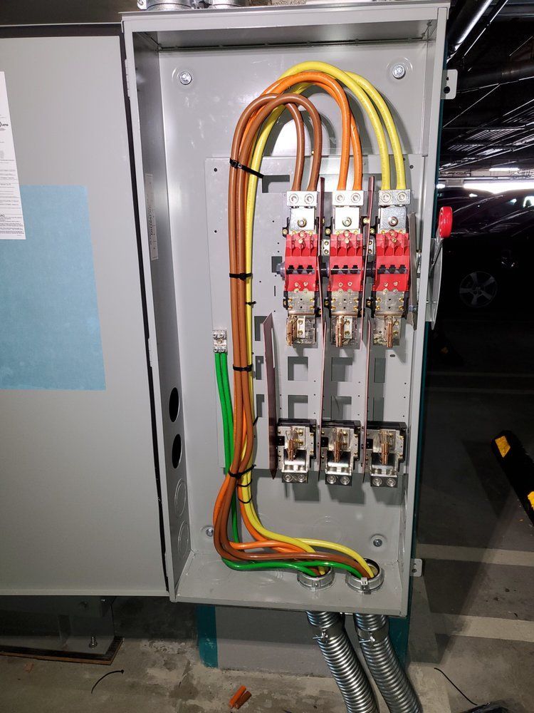 A electrical box with a bunch of wires coming out of it.