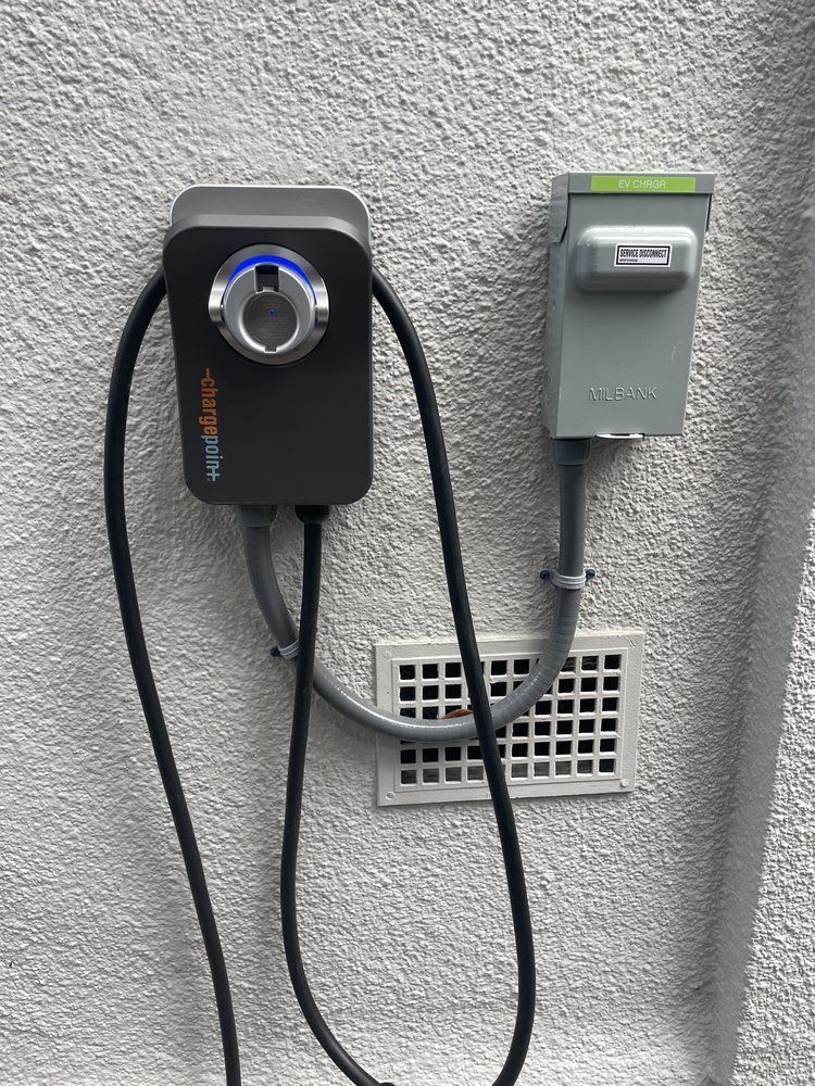 A charger is attached to the side of a building.