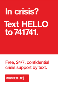 A red sign that says in crisis text hello to 741741