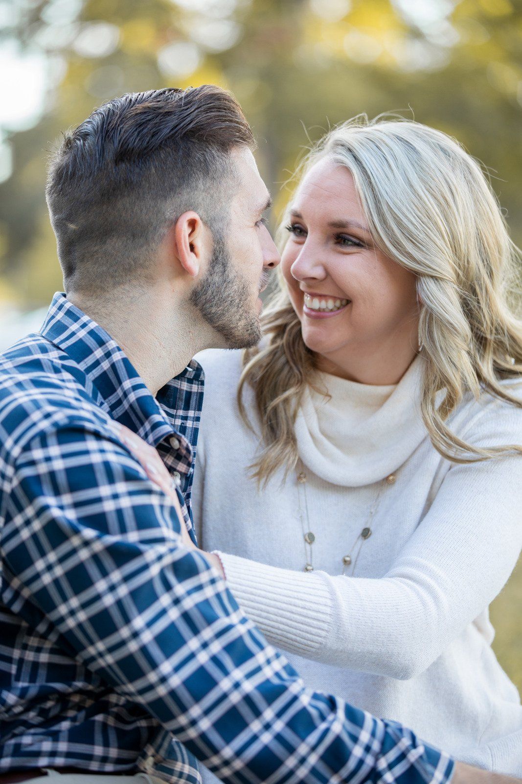 A man is kissing a woman on the cheek.