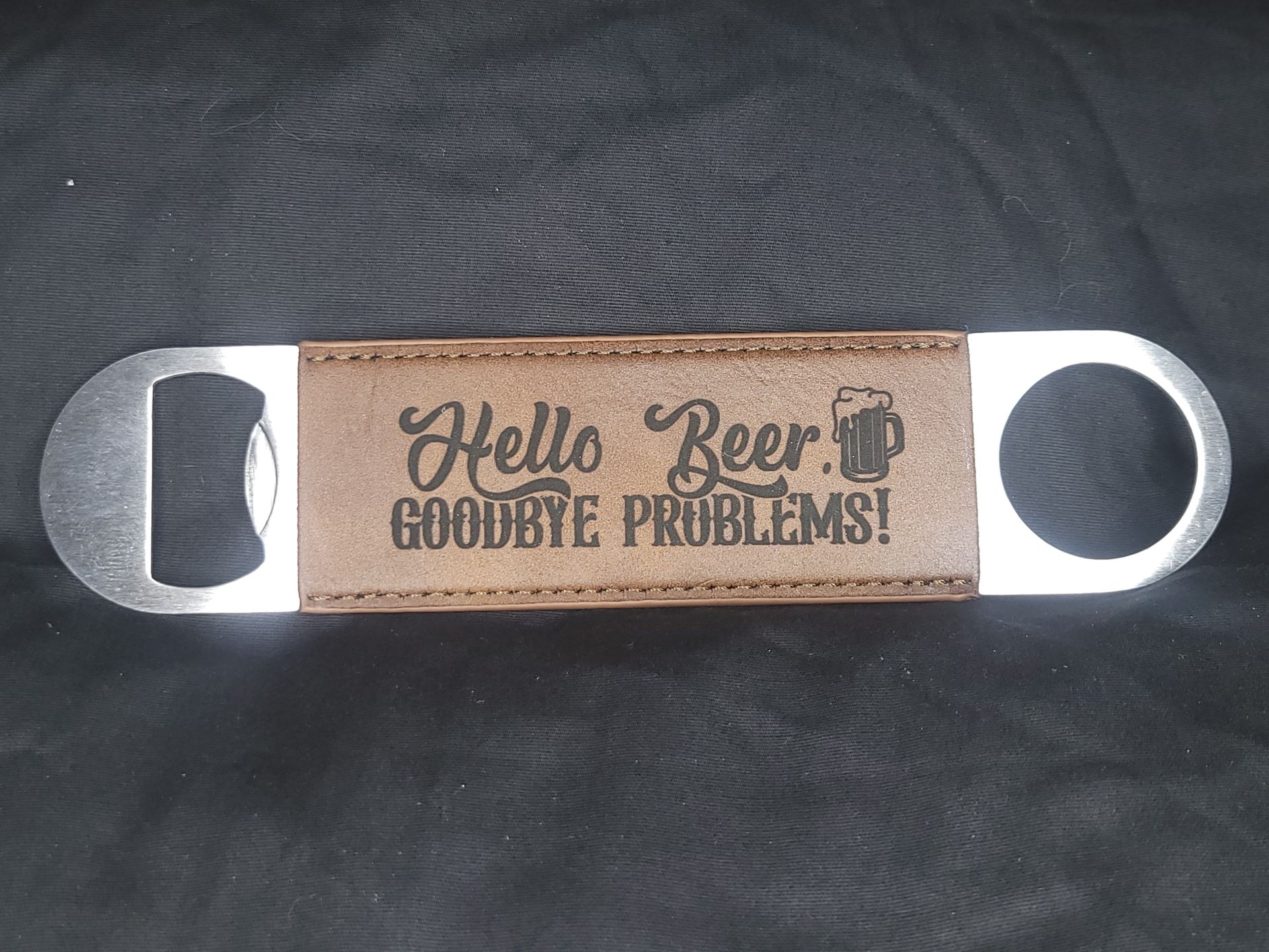 A bottle opener that says hello beer goodbye problems