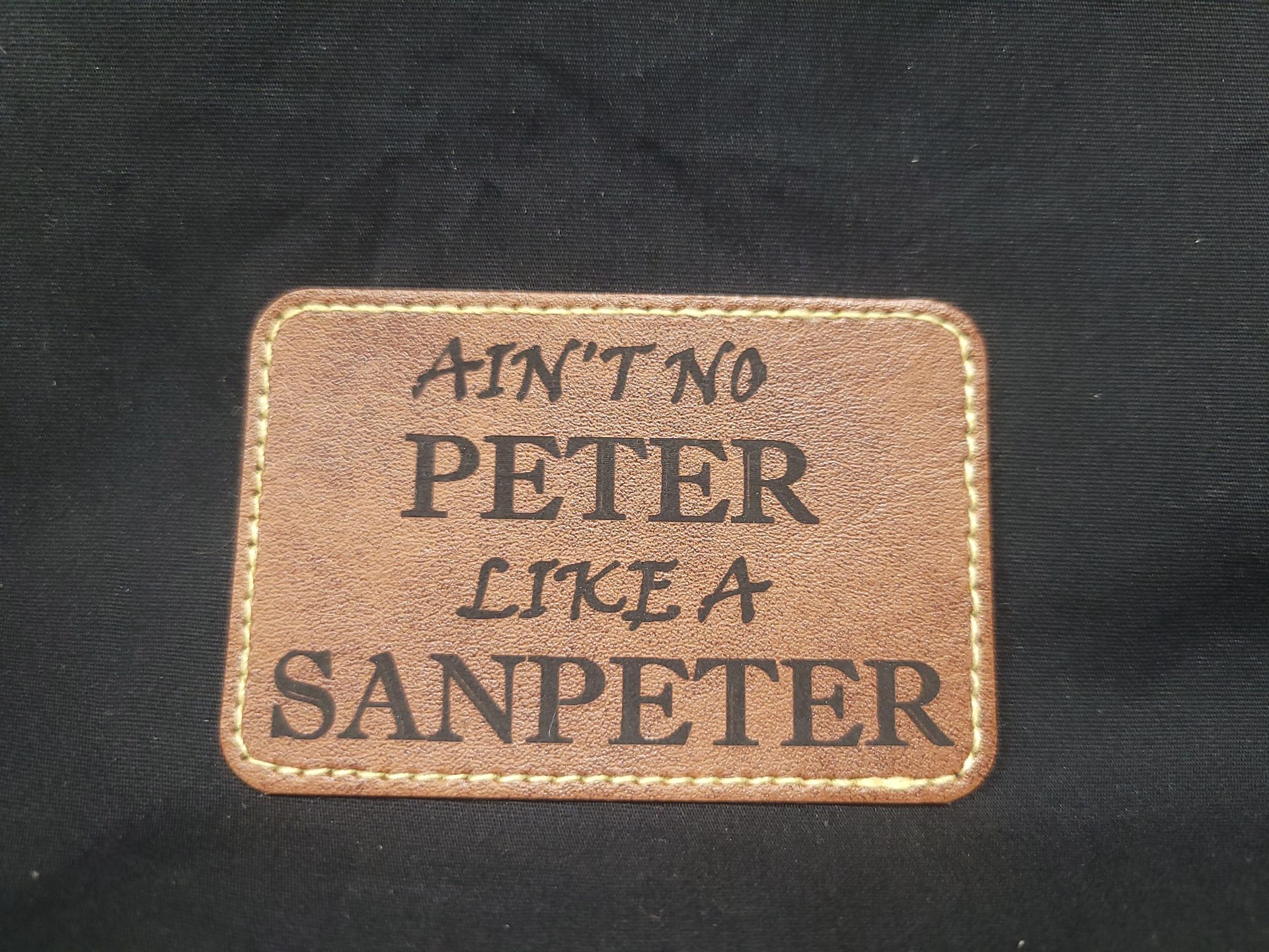 A patch that says ain 't no peter like a sanpeter