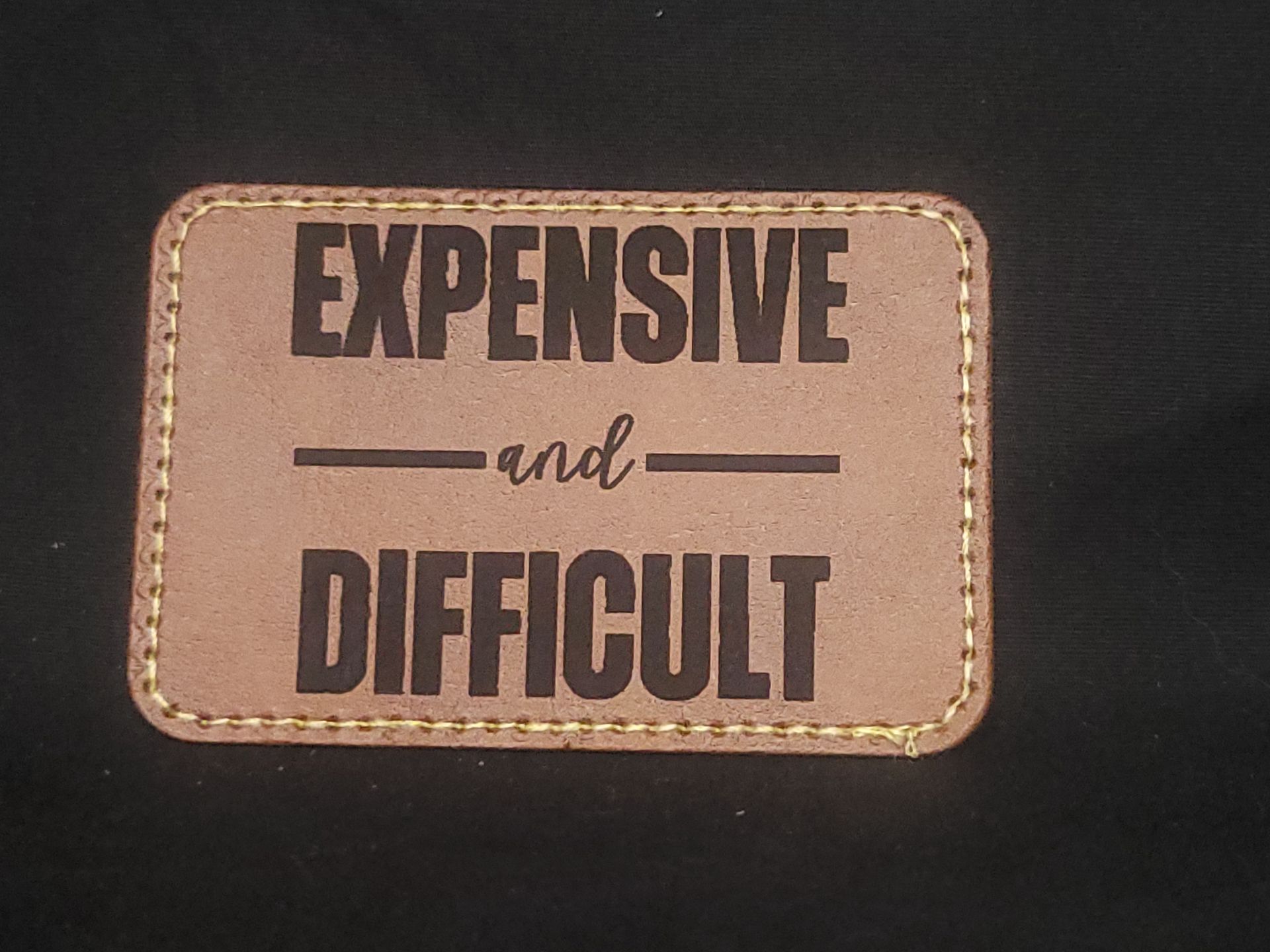 A brown leather patch that says expensive and difficult