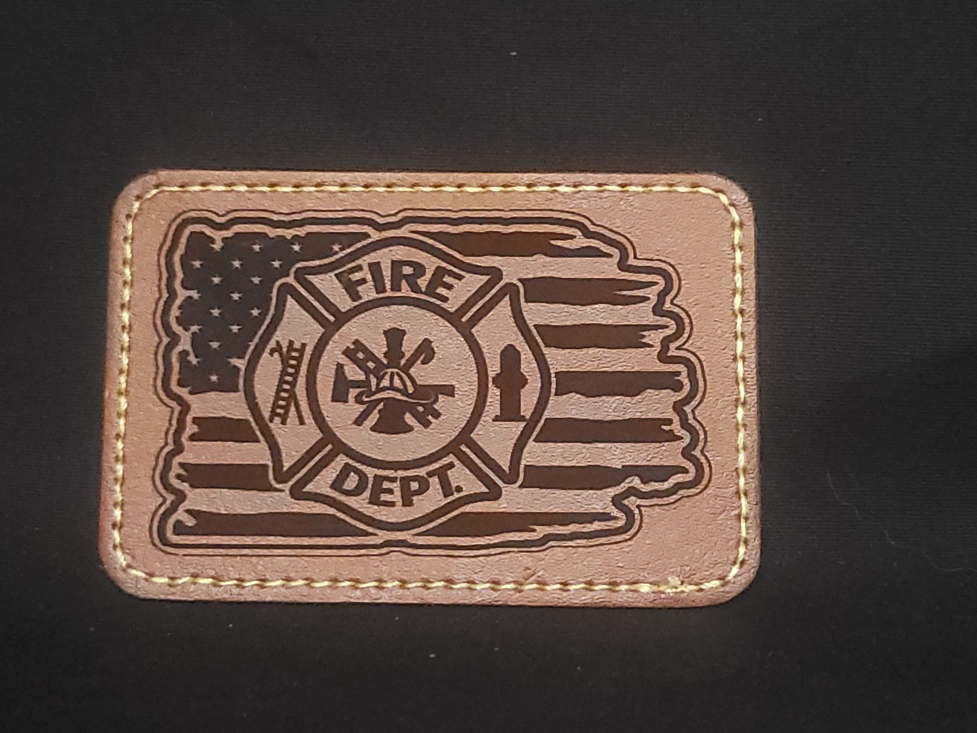 A patch that says fire dept on it