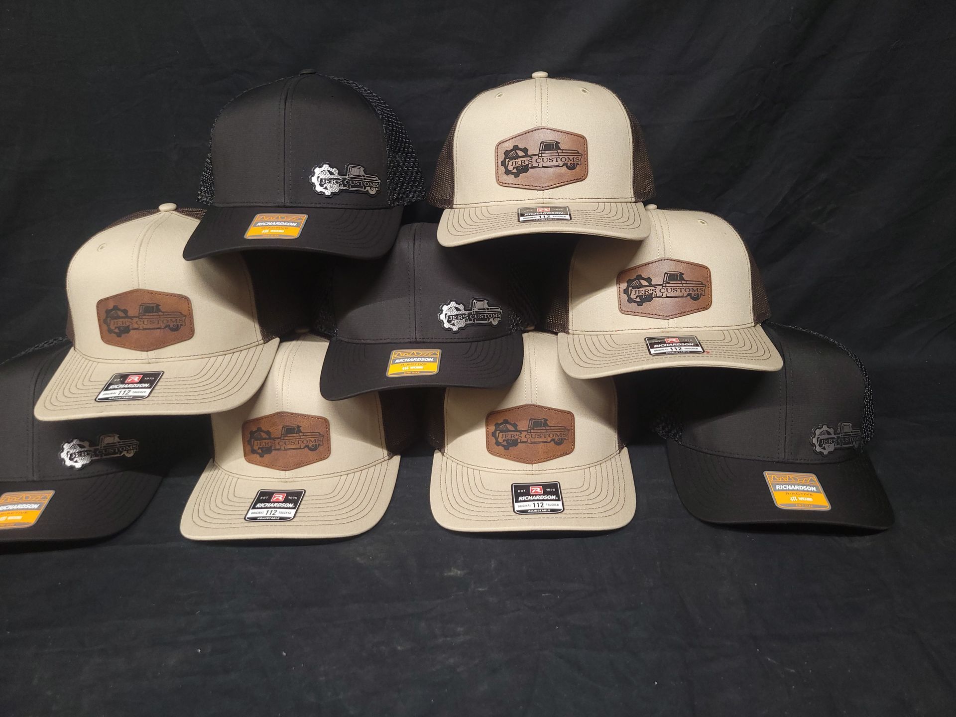 A group of hats are sitting on top of each other on a table.