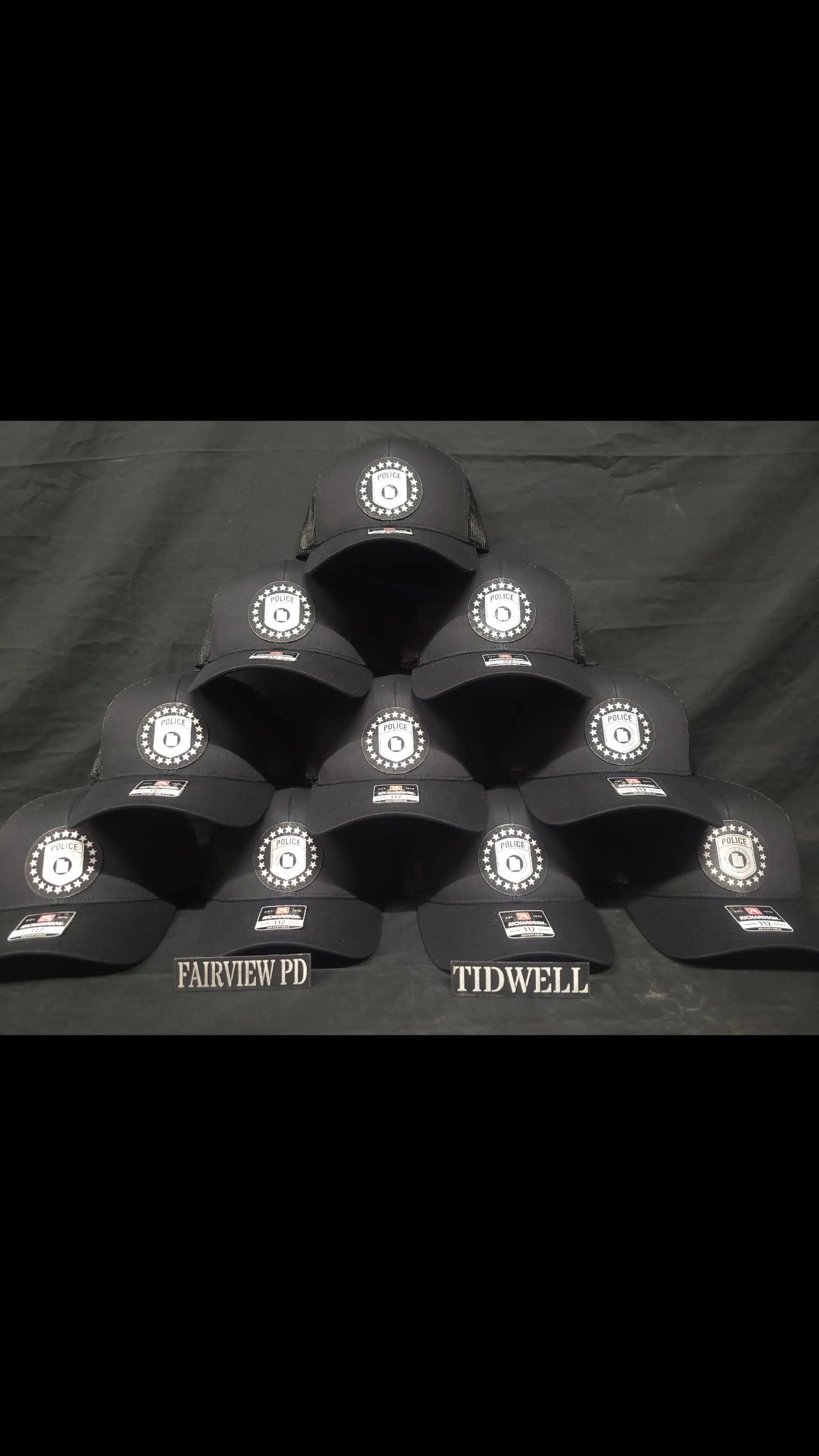 A bunch of hats are stacked on top of each other on a table.