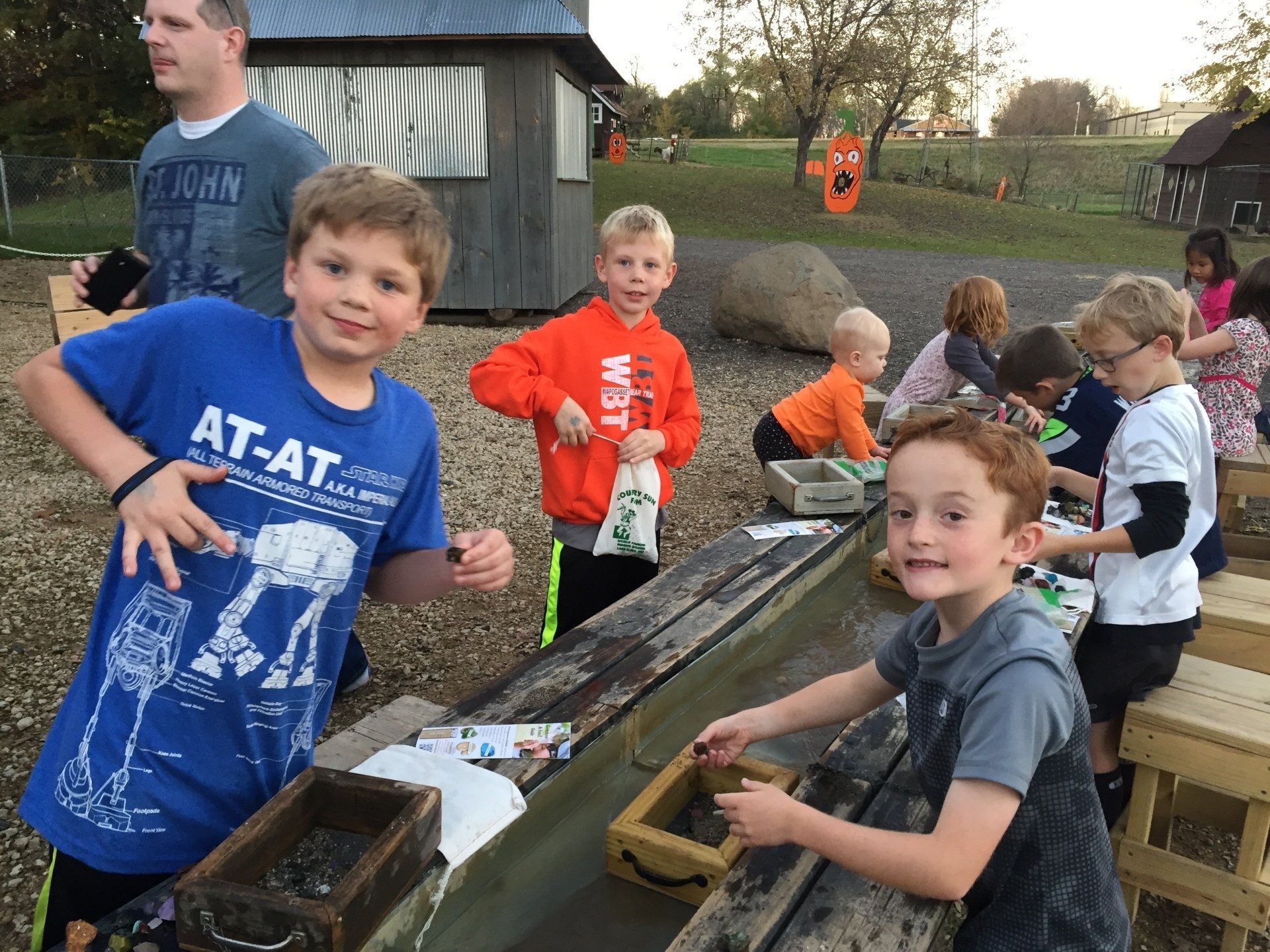A boy wearing a blue shirt that says at-at