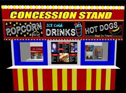 A carnival concession stand with popcorn , ice cold drinks , hot dogs and a menu.