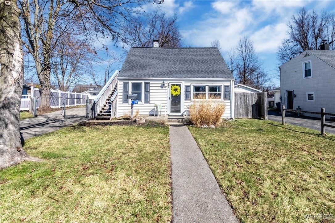 13 Hemlock Lane in Buffalo, NY, featuring a classic two-story home with siding, and a neatly landscaped front yard.
