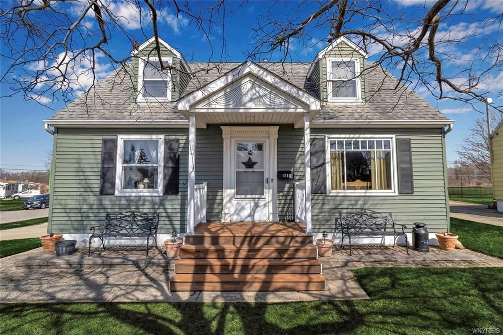 Front view of 1288 Cleveland Dr in Cheektowaga, NY, featuring a well-maintained lawn under a clear blue sky.