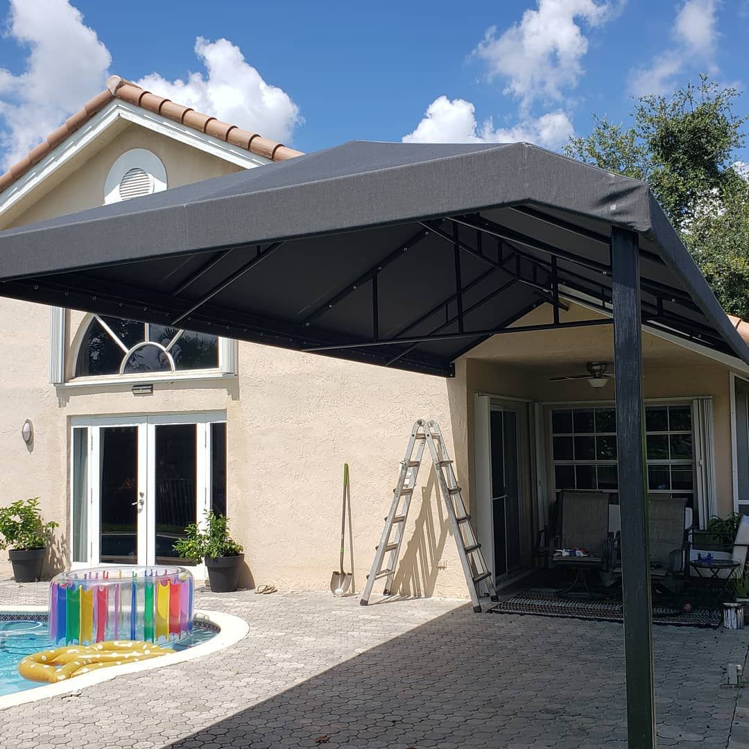 A house with a pool and a canopy over it