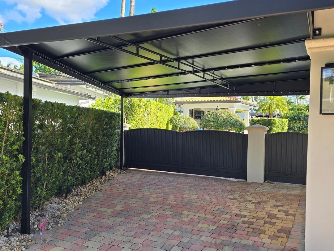 There is a carport with a canopy over it.