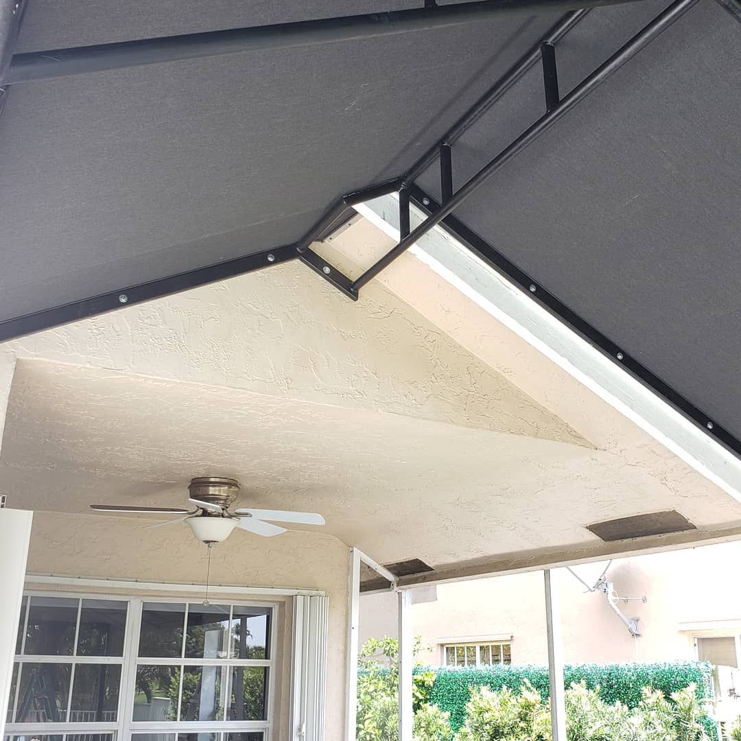 A ceiling fan is hanging from the ceiling of a building