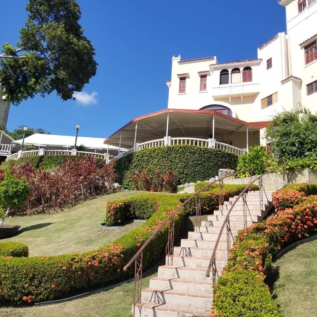 A large white building with stairs leading up to it