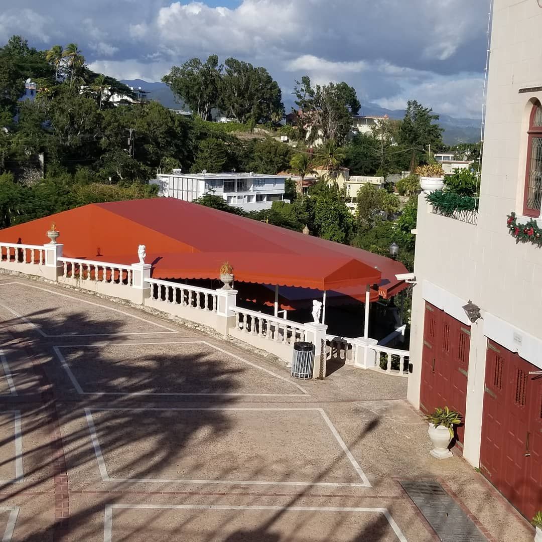 A building with a red awning on top of it