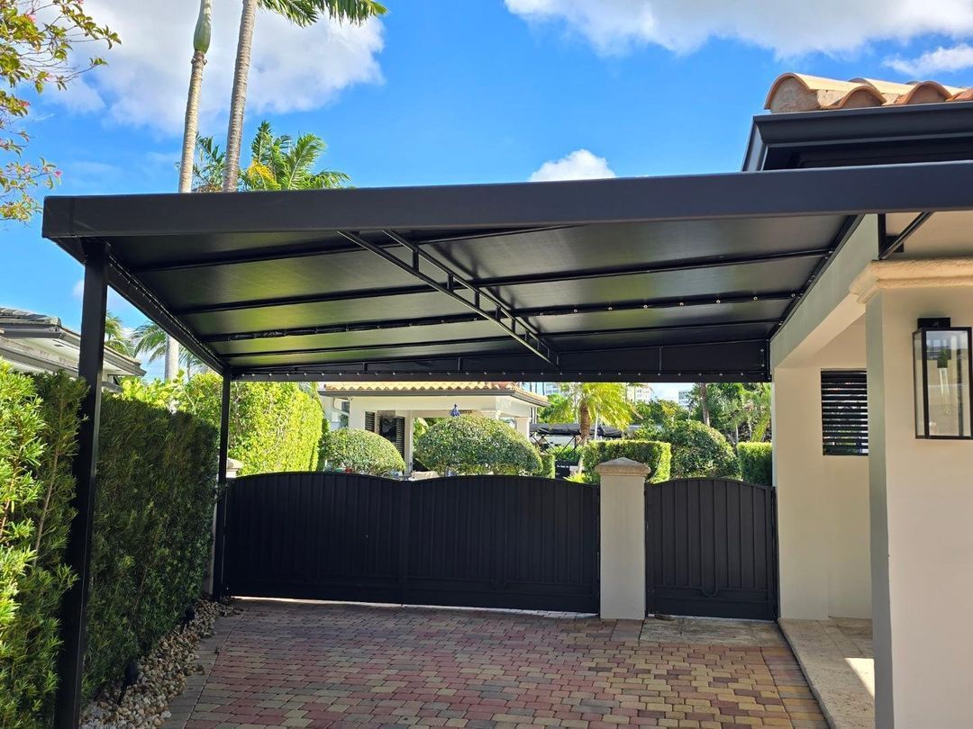 A carport is attached to the side of a house.