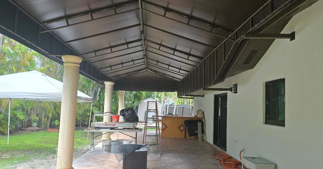 There is a covered porch with a canopy over it.