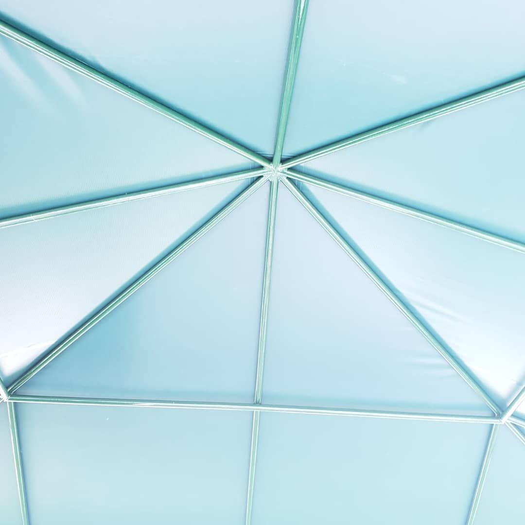A close up of the inside of a blue tent.