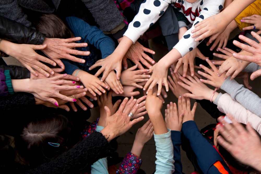 Young girl painting colourful on hand for creative and learning arts