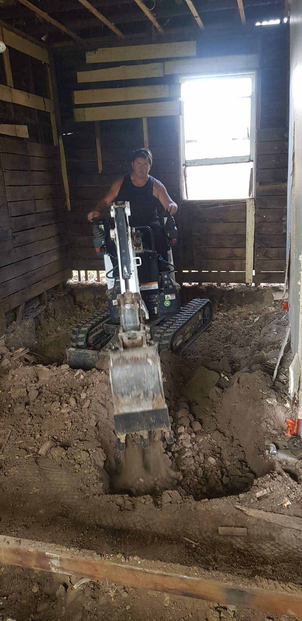 Man removing excess dirt