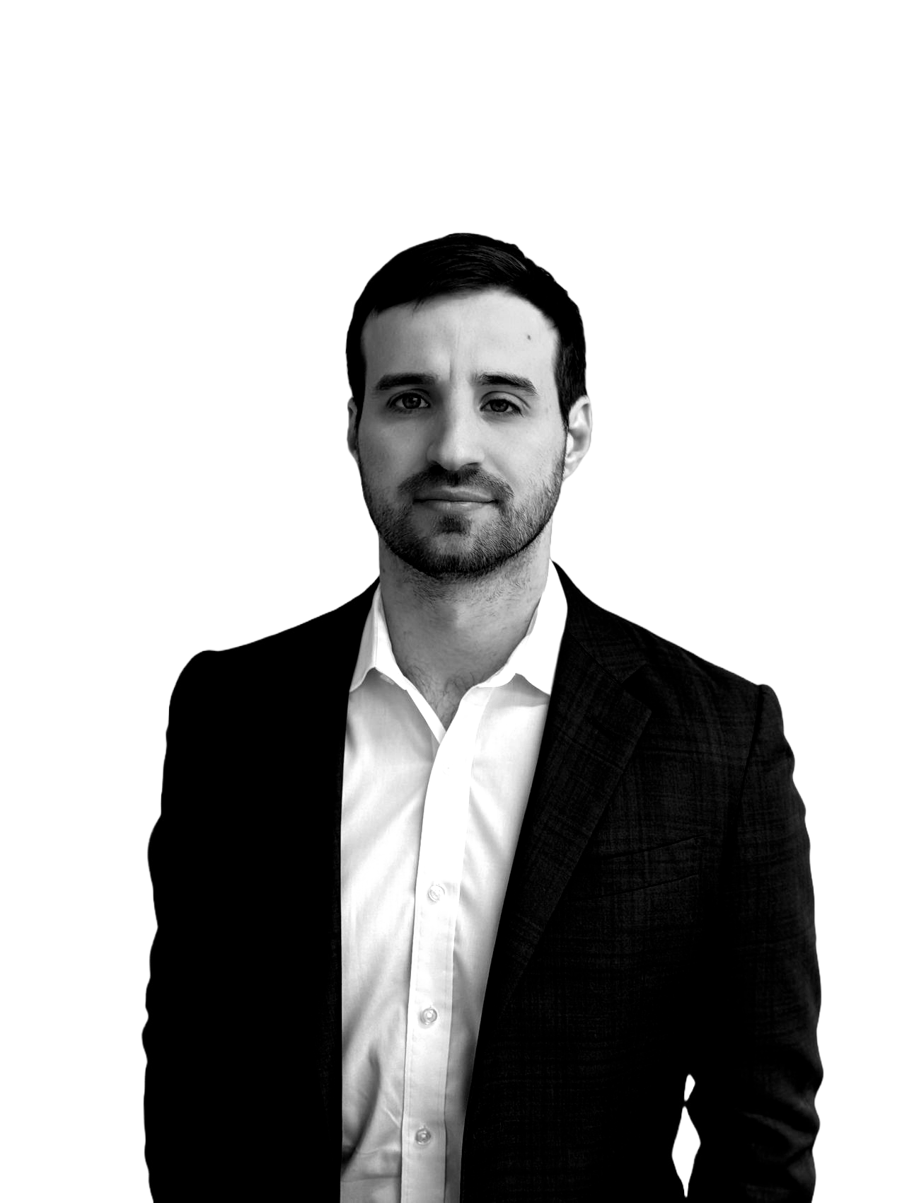 A man in a suit and white shirt is standing in front of a white background.