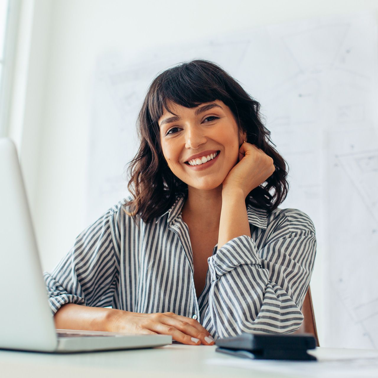 Businesswoman Sitting At Her Desk — Morton Grove, IL — The Insurance Pros