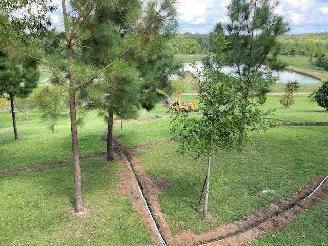 Sprinkler Installation With Excavator Truck — Montgomery, AL — Lawns by Scott
