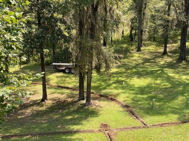 Sprinkler System In The Forest — Montgomery, AL — Lawns by Scott