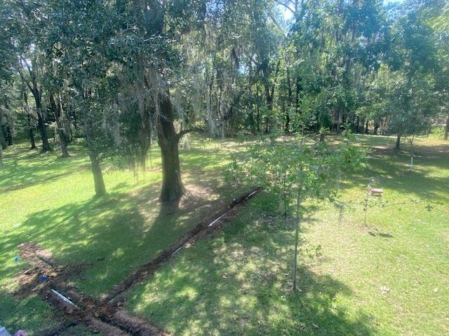 Digged Soil Surrounded By Trees — Montgomery, AL — Lawns by Scott