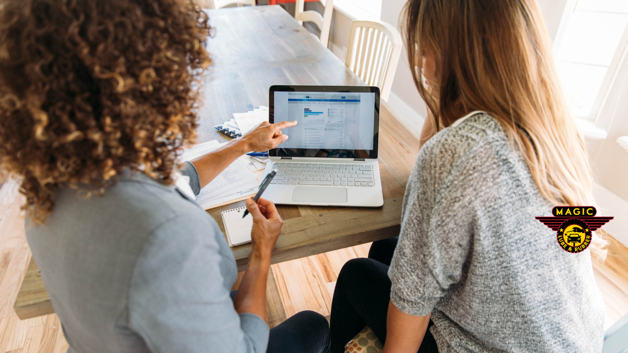 Women looking at billing on laptop
