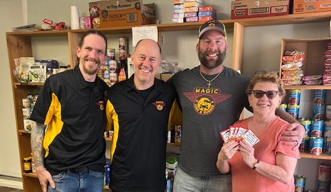 The Magic Lube & Rubber team making donations to the Food Pantry at Our Lady Star of the Sea