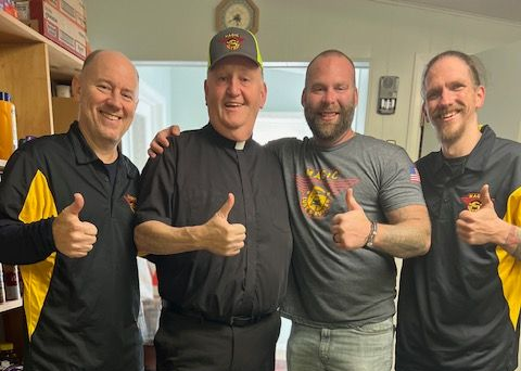 Pictured Brian, Father Sean, Will & Brendan give thumbs up to supporting the food pantry