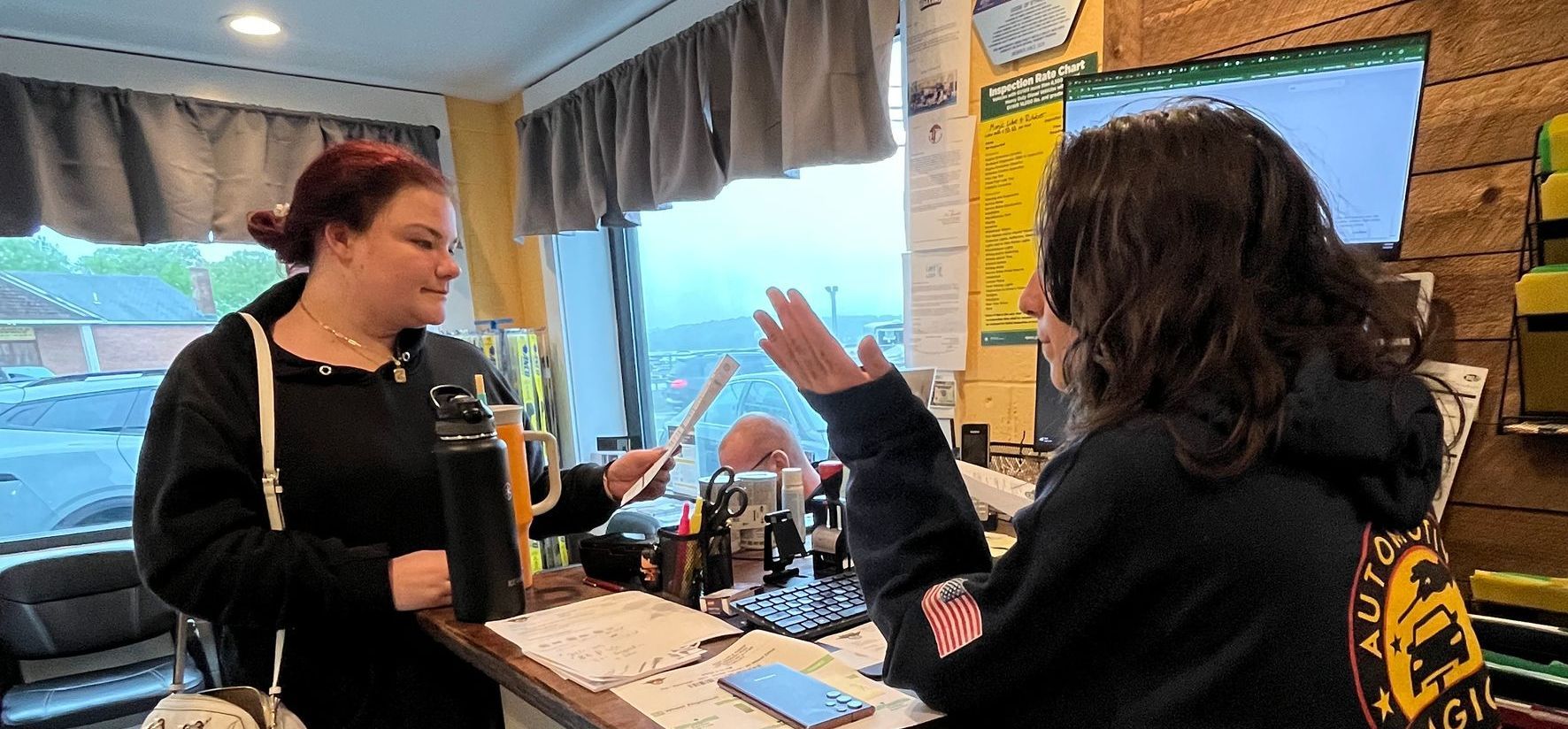 Two Women at Counter | Magic Lube & Rubber