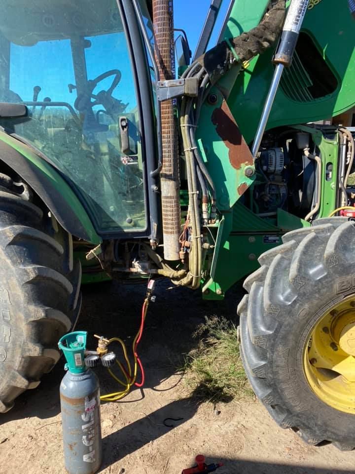 A Green Tractor With the Hood Up is Being Worked on — Activate Auto Electrics & Air Conditioning In Caloundra, QLD